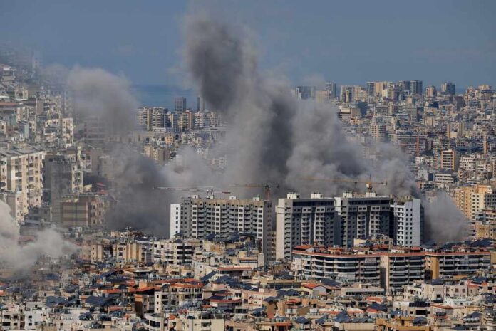 Multiple,Large,Plumes,Of,Thick,Grey,Smoke,Billow,From,Residential Smoke rising from buildings in a densely populated urban area