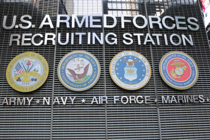 Sign for U.S. Armed Forces Recruiting Station with military branch emblems