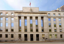 MS-13 Rampage Exposes Border Chaos Facade of a government building with the words Law and Justice and a statue on top