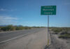 Road sign indicating entry into Maricopa County with a clear blue sky