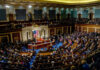 Warrantless Spying Standoff Erupts A large gathering of officials in a congressional chamber during a legislative session