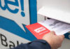 Supreme Court Showdown Upends Mail Votes Person placing a mail-in ballot into a voting drop box