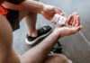 Marijuana Mogul Becomes Endurance Beast Person pouring probiotic pills into their hand