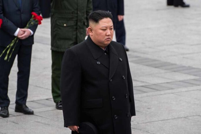 A political figure in formal attire participating in a solemn ceremony