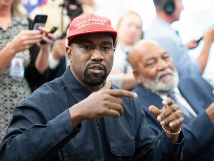 Washington,,Dc,Us,-,Oct,11,,2018:,Kanye,West,Speaks A man wearing a red cap gestures during a discussion at a political event