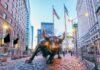 Radical Agenda Scrubbed Before Congress Bid Bronze charging bull sculpture in a city street