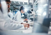 AI Spots Eye Damage Before Vision Blurs Scientists working in a laboratory with microscopes and test tubes