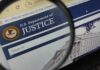 Did DOJ Expose SPLC’s Dark Money? Close-up view of the U.S. Department of Justice website through a magnifying glass