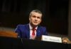 Media War Erupts—Hegseth vs. CBS Man in a blue suit speaking at a government hearing