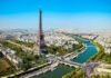 Heatwave Deaths Spike — Paris On Edge Aerial view of the Eiffel Tower in Paris with the Seine River and cityscape
