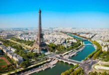 Aerial view of the Eiffel Tower in Paris with the Seine River and cityscape