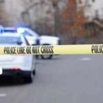 Horror In Wyong, Evidence Still Sealed Police tape cordons off a street with patrol cars in the background