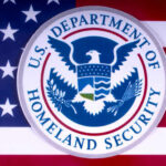U.S. Department of Homeland Security emblem on a background of the American flag