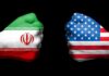 Jordan Base Hit After ‘Peace’ Promise Fists painted as Iran and United States flags facing each other