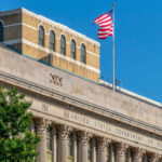 Facade of the United States Department of Agriculture building with an American flag