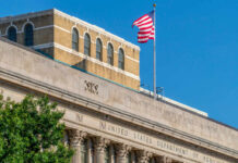 Facade of the United States Department of Agriculture building with an American flag