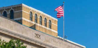 Facade of the United States Department of Agriculture building with an American flag