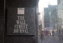 The Wall Street Journal plaque on a building exterior