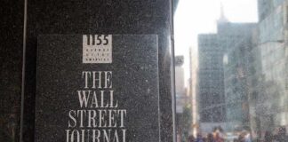 The Wall Street Journal plaque on a building exterior