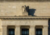 Debt Time Bomb Meets Fed Gambit Facade of the Federal Reserve building featuring an eagle sculpture