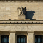 Debt Time Bomb Meets Fed Gambit Facade of the Federal Reserve building featuring an eagle sculpture