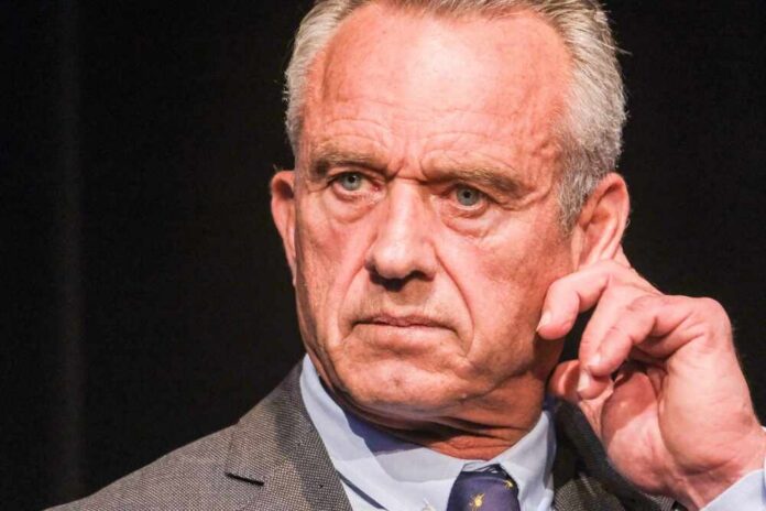 Close-up of a man in a suit with a serious expression