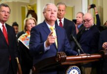 D.C. Turmoil After Sudden Senator Death A group of government officials at a press conference with one speaking into a microphone