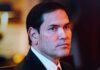 Pardon Twist Sparks Federal Showdown A serious-looking man in formal attire with a focused gaze