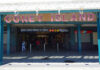 Entrance to Coney Island subway station with people walking