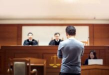 Murder-For-Hire Plot Grips Florida Court defendant stands before judges in a courtroom