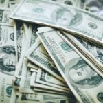 Budget Bombshell Triggers Towson Shake-Up Stacks of U.S. hundred-dollar bills