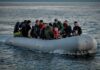 Group of people in an inflatable boat on open water
