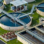 Wastewater treatment plant with circular clarifiers and aeration tanks