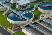 Wastewater treatment plant with circular clarifiers and aeration tanks