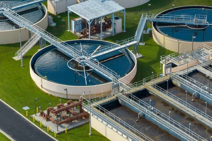 Wastewater treatment plant with circular clarifiers and aeration tanks