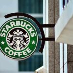 Starbucks coffee shop sign on building exterior