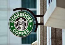 Starbucks coffee shop sign on building exterior