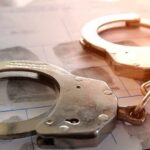 Handcuffs on a fingerprint form