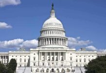 United States Capitol building with white dome under blue sky