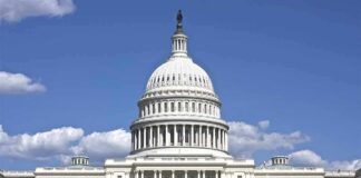 United States Capitol building with white dome under blue sky