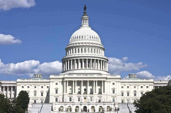 United States Capitol building with white dome under blue sky