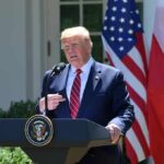 UN Showdown: Trump’s Risky Venezuela Gamble man at presidential podium speaking outdoors
