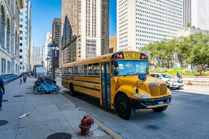 Yellow school bus on a city street beside skyscrapers