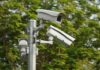surveillance cameras mounted on a metal pole