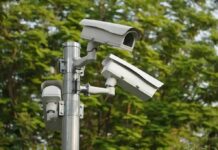 Behavior Scanners Stir Berlin Backlash surveillance cameras mounted on a metal pole