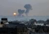 Election Day Barrage Hits Russia Cityscape with distant explosions and rising smoke