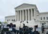 U.S. Supreme Court building with media equipment set up outside