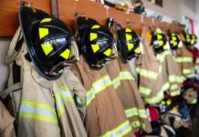Paperwork Twist Blocks EMT Firefighter Firefighter helmets and turnout coats hanging on hooks