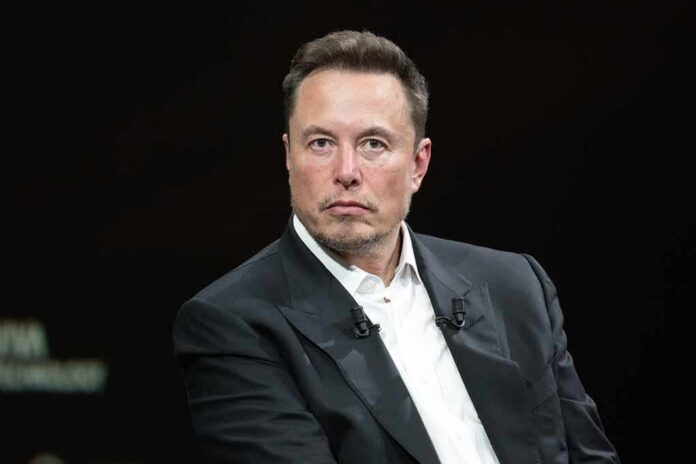 shutterstock_2318800341 Elon Musk in a dark suit during an onstage talk