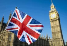 Union Jack flag with Elizabeth Tower in the background